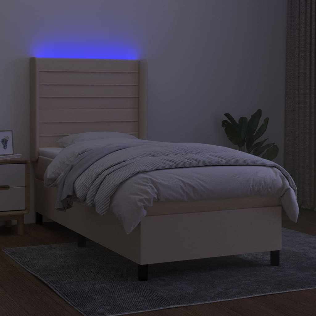 Box spring postelja z vzmetnico LED krem 90x200 cm blago